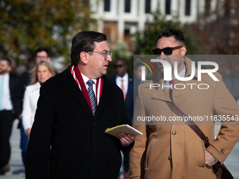 Tennessee Attorney General Jonathan Skrmetti talks with an aide following oral arguments at the Supreme Court on his state's ban on gender-a...