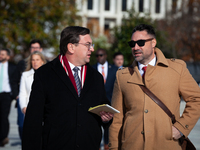 Tennessee Attorney General Jonathan Skrmetti talks with an aide following oral arguments at the Supreme Court on his state's ban on gender-a...