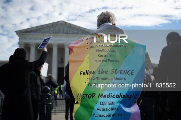 Sherrie Taha demonstrates against gender-affirming care for transgender children outside the Supreme Court in Washington, DC, on December 4,...