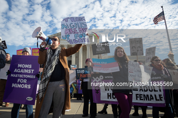 People demonstrate both for and against gender-affirming care for transgender children at the Supreme Court in Washington, DC, on December 4...