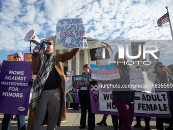 People demonstrate both for and against gender-affirming care for transgender children at the Supreme Court in Washington, DC, on December 4...