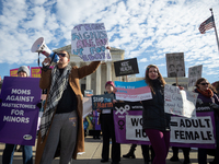 People demonstrate both for and against gender-affirming care for transgender children at the Supreme Court in Washington, DC, on December 4...