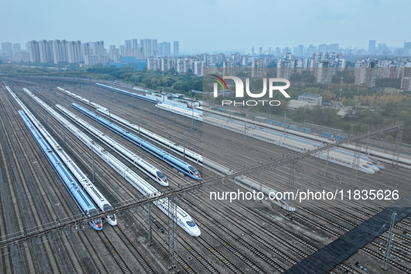 In Nanjing, China, on December 5, 2024, a photo shows EMU trains at Nanjing Bullet Train Station in East China's Jiangsu province. 