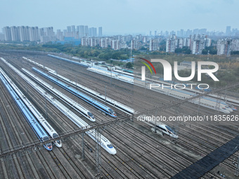 In Nanjing, China, on December 5, 2024, a photo shows EMU trains at Nanjing Bullet Train Station in East China's Jiangsu province. (