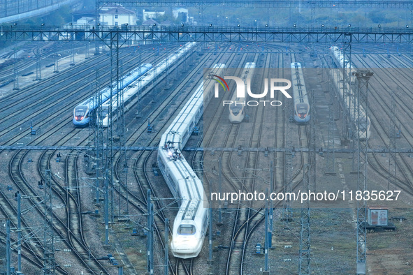 In Nanjing, China, on December 5, 2024, a photo shows EMU trains at Nanjing Bullet Train Station in East China's Jiangsu province. 