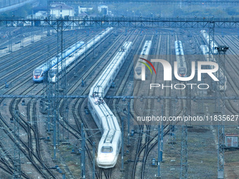 In Nanjing, China, on December 5, 2024, a photo shows EMU trains at Nanjing Bullet Train Station in East China's Jiangsu province. (