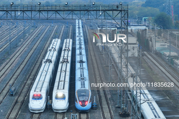 In Nanjing, China, on December 5, 2024, a photo shows EMU trains at Nanjing Bullet Train Station in East China's Jiangsu province. 