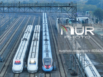 In Nanjing, China, on December 5, 2024, a photo shows EMU trains at Nanjing Bullet Train Station in East China's Jiangsu province. (