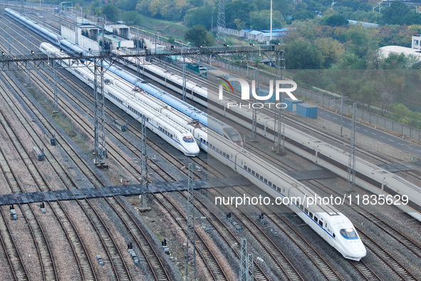 In Nanjing, China, on December 5, 2024, a photo shows EMU trains at Nanjing Bullet Train Station in East China's Jiangsu province. 