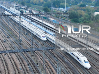 In Nanjing, China, on December 5, 2024, a photo shows EMU trains at Nanjing Bullet Train Station in East China's Jiangsu province. (