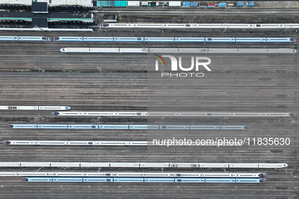 In Nanjing, China, on December 5, 2024, a photo shows EMU trains at Nanjing Bullet Train Station in East China's Jiangsu province. 