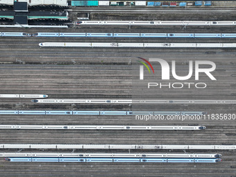 In Nanjing, China, on December 5, 2024, a photo shows EMU trains at Nanjing Bullet Train Station in East China's Jiangsu province. (