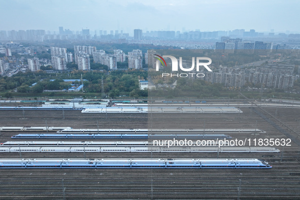 In Nanjing, China, on December 5, 2024, a photo shows EMU trains at Nanjing Bullet Train Station in East China's Jiangsu province. 