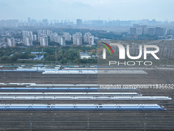 In Nanjing, China, on December 5, 2024, a photo shows EMU trains at Nanjing Bullet Train Station in East China's Jiangsu province. (