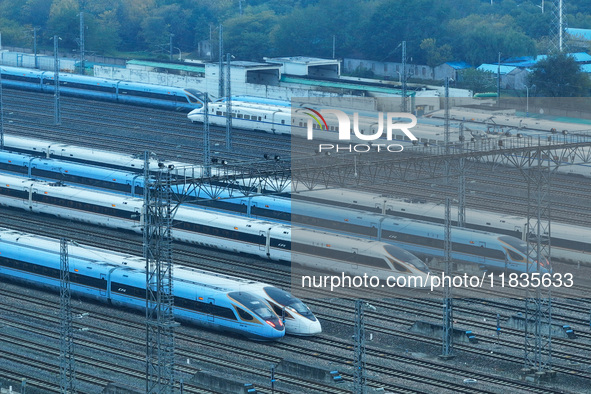 In Nanjing, China, on December 5, 2024, a photo shows EMU trains at Nanjing Bullet Train Station in East China's Jiangsu province. 