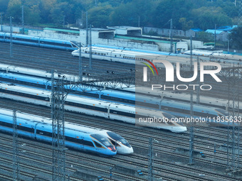 In Nanjing, China, on December 5, 2024, a photo shows EMU trains at Nanjing Bullet Train Station in East China's Jiangsu province. (