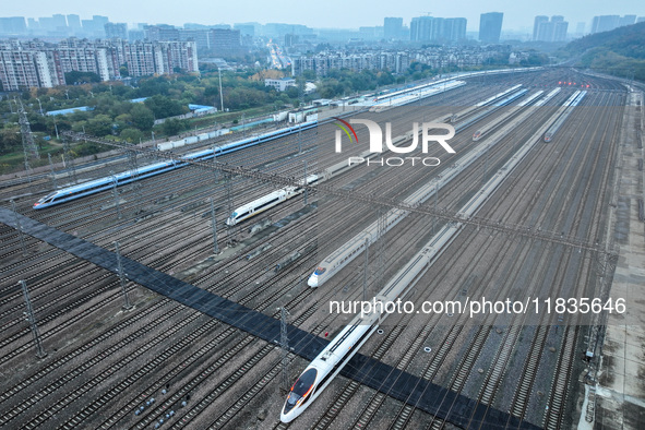 In Nanjing, China, on December 5, 2024, a photo shows EMU trains at Nanjing Bullet Train Station in East China's Jiangsu province. 