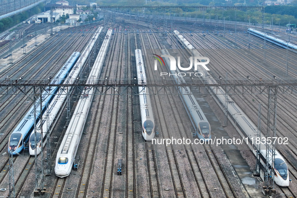 In Nanjing, China, on December 5, 2024, a photo shows EMU trains at Nanjing Bullet Train Station in East China's Jiangsu province. 