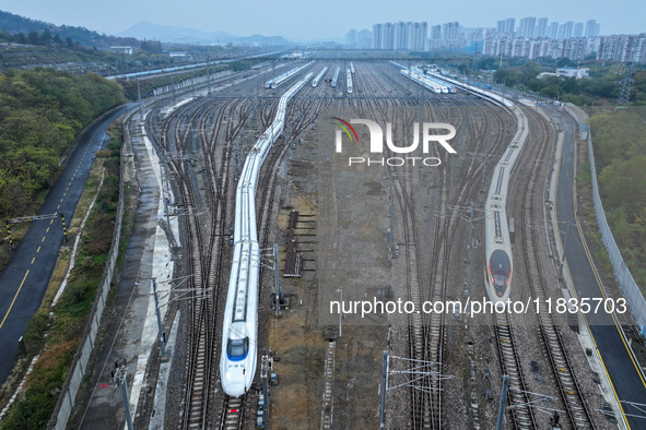 In Nanjing, China, on December 5, 2024, a photo shows EMU trains at Nanjing Bullet Train Station in East China's Jiangsu province. 