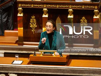 Mathilde Feld, deputy of the La France Insoumise group, speaks during the session examining the report of the 2024 end-of-year finance bill...