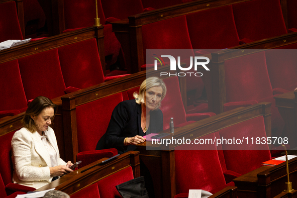 Marine Le Pen, President of the Rassemblement National group, is seen during the session of examination of the report of the 2024 end-of-yea...