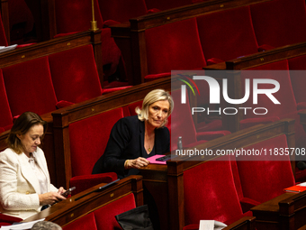 Marine Le Pen, President of the Rassemblement National group, is seen during the session of examination of the report of the 2024 end-of-yea...