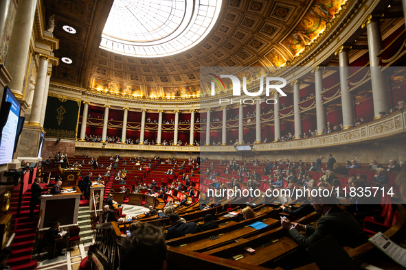 A general view of the hemicycle of the National Assembly during the session for examining the report of the 2024 end-of-year finance bill ta...