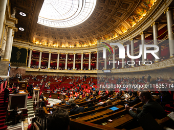 A general view of the hemicycle of the National Assembly during the session for examining the report of the 2024 end-of-year finance bill ta...