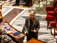 Elisabeth Borne, deputy of the Ensemble pour la Republique group, is seen during the session of examination of the report of the 2024 end-of...