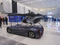 Visitors look at a Chery composite wing modular flying car at the Zhejiang International Intelligent Transportation Industry Expo in Hangzho...