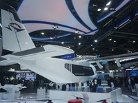 Visitors watch the world's first ton super hybrid cargo drone ''Tianmushan III'' at the Zhejiang International Intelligent Transportation In...