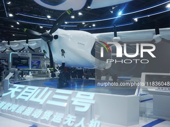 Visitors watch the world's first ton super hybrid cargo drone ''Tianmushan III'' at the Zhejiang International Intelligent Transportation In...