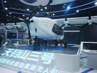 Visitors watch the world's first ton super hybrid cargo drone ''Tianmushan III'' at the Zhejiang International Intelligent Transportation In...