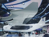 Visitors watch the world's first ton super hybrid cargo drone ''Tianmushan III'' at the Zhejiang International Intelligent Transportation In...