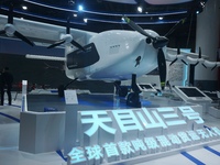 Visitors watch the world's first ton super hybrid cargo drone ''Tianmushan III'' at the Zhejiang International Intelligent Transportation In...