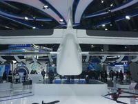 Visitors watch the world's first ton super hybrid cargo drone ''Tianmushan III'' at the Zhejiang International Intelligent Transportation In...