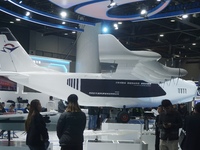 Visitors watch the world's first ton super hybrid cargo drone ''Tianmushan III'' at the Zhejiang International Intelligent Transportation In...