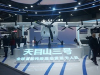 Visitors watch the world's first ton super hybrid cargo drone ''Tianmushan III'' at the Zhejiang International Intelligent Transportation In...