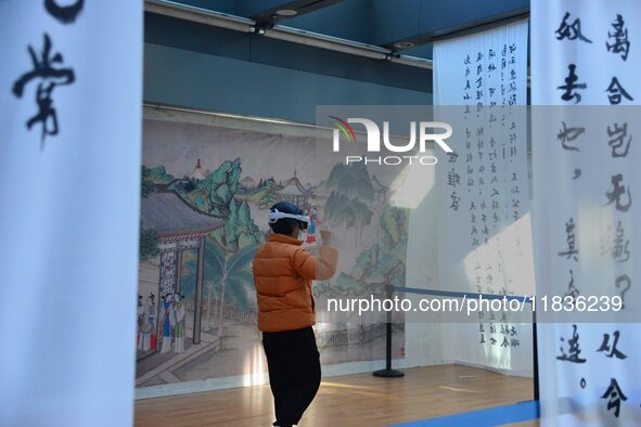 Visitors wear MR Glasses during an immersive interactive exhibition at the Capital Museum in Beijing, China, on December 5, 2024. 