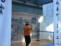 Visitors wear MR Glasses during an immersive interactive exhibition at the Capital Museum in Beijing, China, on December 5, 2024. (