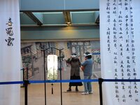 Visitors wear MR Glasses during an immersive interactive exhibition at the Capital Museum in Beijing, China, on December 5, 2024. (