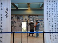 Visitors wear MR Glasses during an immersive interactive exhibition at the Capital Museum in Beijing, China, on December 5, 2024. (