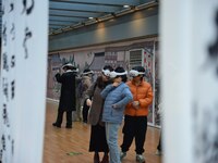 Visitors wear MR Glasses during an immersive interactive exhibition at the Capital Museum in Beijing, China, on December 5, 2024. (