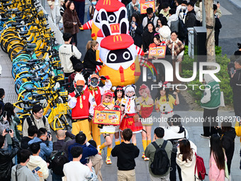 Products from the collaboration between the game Zenless Zone Zero and McDonald's parade through the streets in Shanghai, China, on December...