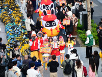 Products from the collaboration between the game Zenless Zone Zero and McDonald's parade through the streets in Shanghai, China, on December...