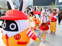 Products from the collaboration between the game Zenless Zone Zero and McDonald's parade through the streets in Shanghai, China, on December...