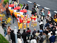 Products from the collaboration between the game Zenless Zone Zero and McDonald's parade through the streets in Shanghai, China, on December...