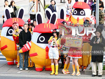 Products from the collaboration between the game Zenless Zone Zero and McDonald's parade through the streets in Shanghai, China, on December...