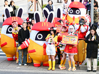 Products from the collaboration between the game Zenless Zone Zero and McDonald's parade through the streets in Shanghai, China, on December...