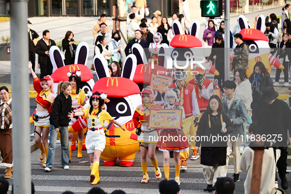 Products from the collaboration between the game Zenless Zone Zero and McDonald's parade through the streets in Shanghai, China, on December...